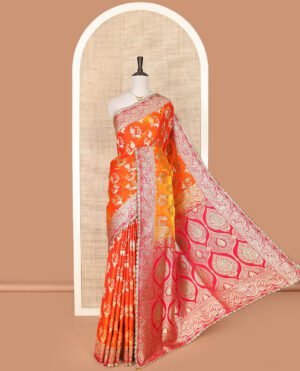 Orange Art Vastrakala Silk Saree Bedecked With Zari Buttas With Stone Work All Over Its Body, Complemented By A Contrast Floral Scallop Design Zari Stone Work Border, Mughal-Design Pallu Detailed In Zari And Stone Work, And Paired With A Contrast Blouse