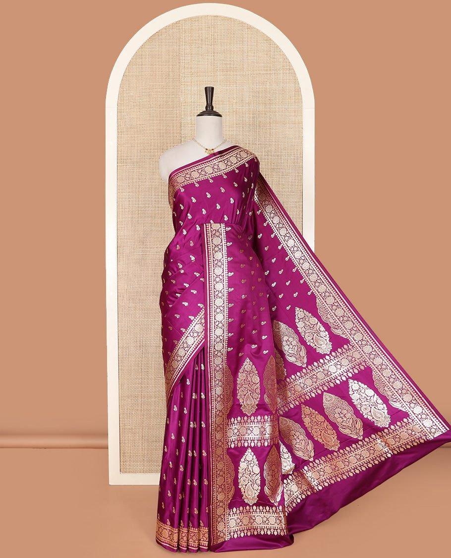Purple Semi-Banaras Satin Saree Richly Detailed With Zari Buttas, Subtly Sparkled Border Of Floral Creeper Designs, Pallu Prettified With Mughal-Style Intricate Motifs In Zari, And Paired With A Matching Blouse
