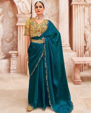 Peacock Blue Plain Designer Saree With Temple Lace Border, A Readymade Blouse, A Contrast Embroidered Belt, And A Pair Of Free Embroidered Punjabi Shoes