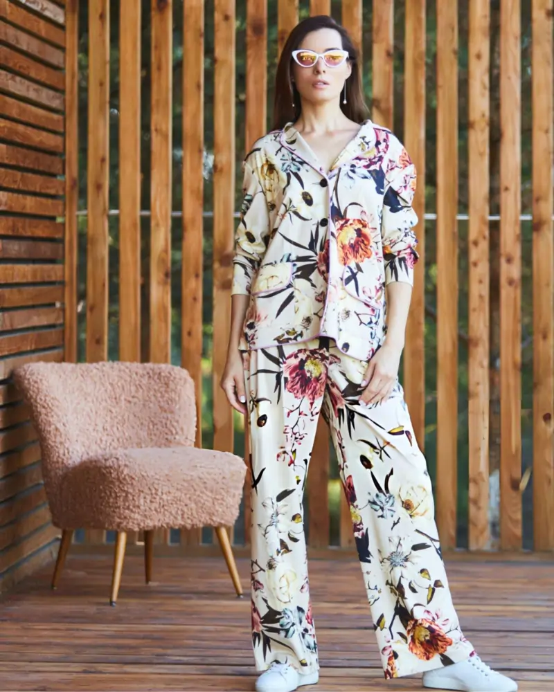Woman wearing floral loungewear and sunglasses, representing comfortable lifestyle and mental wellness.