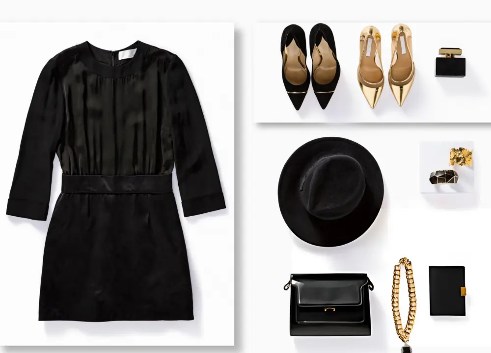Flat lay of black dress, gold heels, and accessories for elegant professional wellness events.