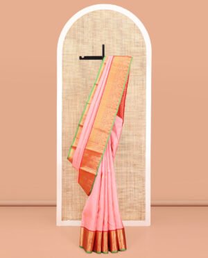Pink Vasundhara Silk Saree, Decked Up With Zari Buttas And Stripes All Over Its Body, Complemented By A Contrast Border Of Rekku, Kodi Visiry, Jaal, And Mayil Designs, Grand Jaal Pallu, And Paired With A Contrast Blouse
