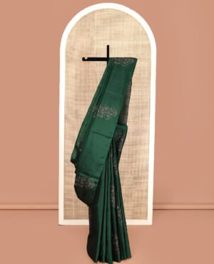 Borderless Green Mayuri Soft Silk Saree, Elevated With Buttas All Over Its Body, A Sparsely Sparkled Self-Pallu, And Paired With A Matching Blouse