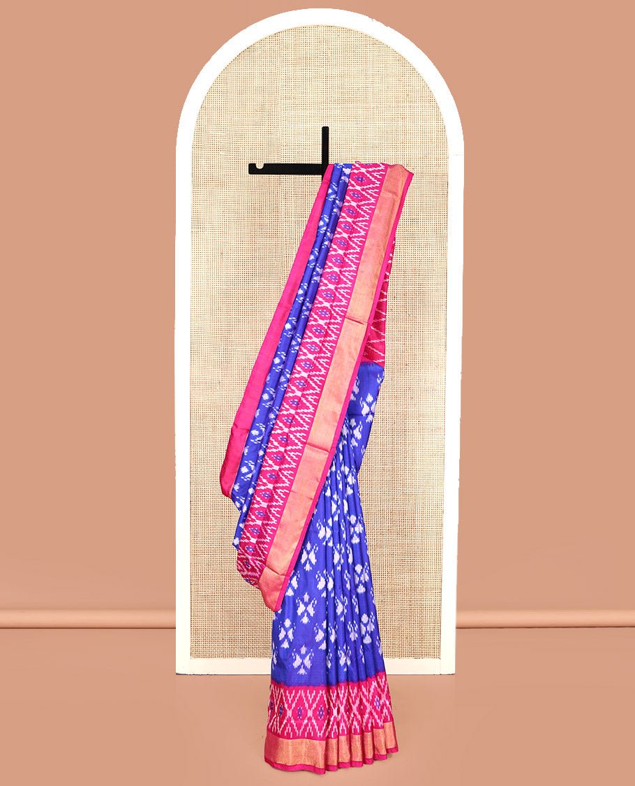 Royal Blue Pochampally Ikat Silk Saree, Adorned With Ikkat Buttas On Its Body, Complemented By A Contrast Ikkat-Style Woven Border, Pallu Of Butta Enclosed Jaal Design, And Paired With A Contrast Blouse