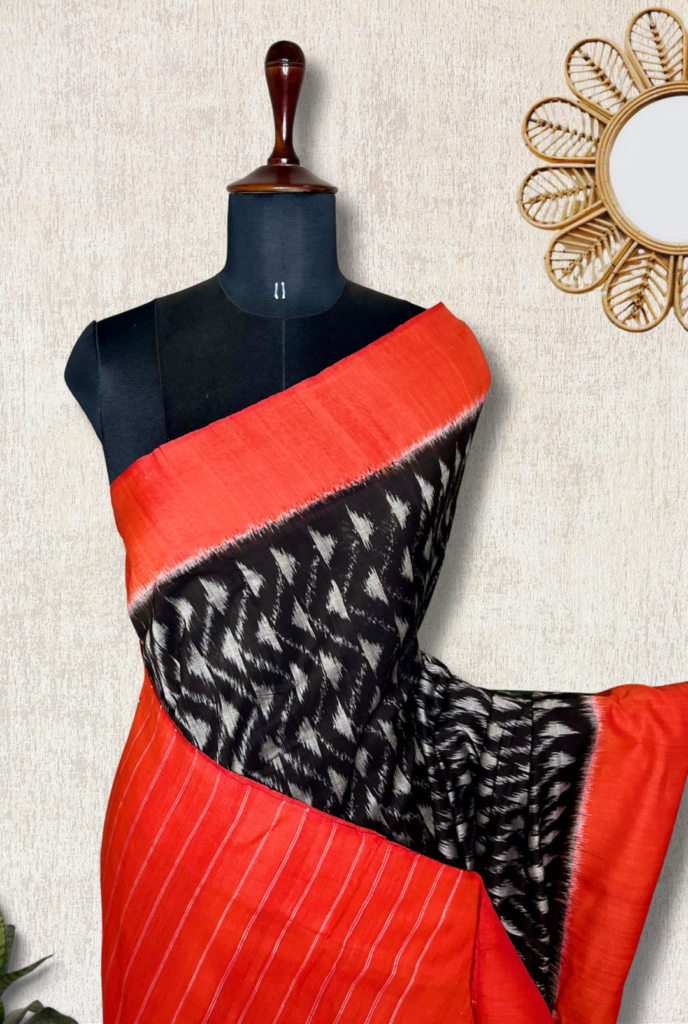 Exp – Handwoven Pochampally Cotton Saree – Charcoal Black + Brick Orange by Tamara Chennai, South Asian ethnic wear