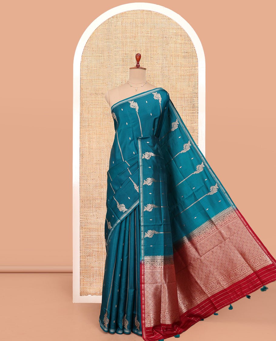 Peacock Blue Satin Silk Saree, Steeped In Richness Of Floral Design All Over Its Body, A Subtle Zari Piping Border, Complemented By A Contrast Jaal Design Pallu, And Paired With A Contrast Blouse