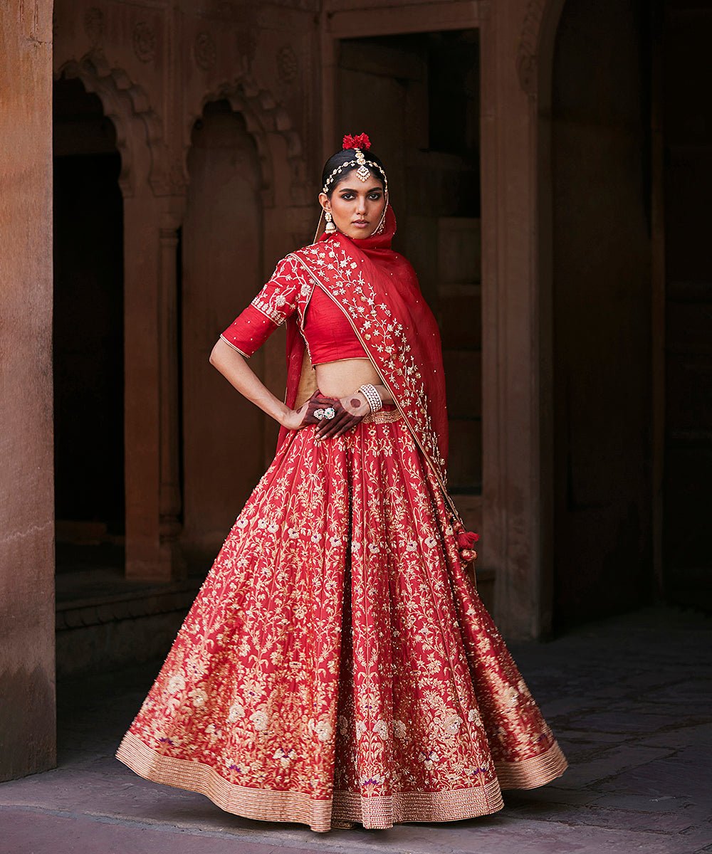 Red Hand Embroidered Zardozi Banarasi Lehenga With Raw Silk Blouse And Dupatta by WeaverStory, South Asian ethnic wear