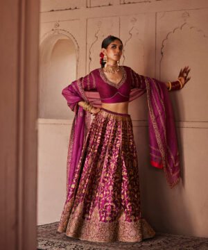 Mulled Wine Hand Embroidered Zardozi Banarasi Lehenga With Blouse And Dupatta by WeaverStory, South Asian ethnic wear