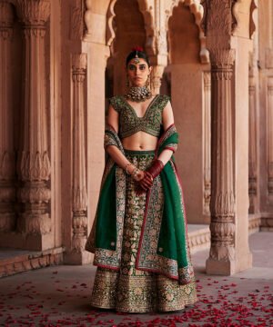 Deep Green Hand Embroidered Zardozi Banarasi Lehenga With Blouse And Dupatta by WeaverStory, South Asian ethnic wear